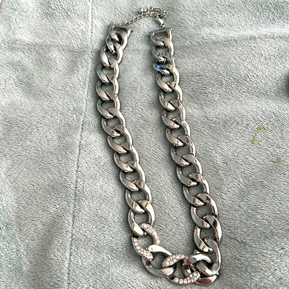 Silver necklace is